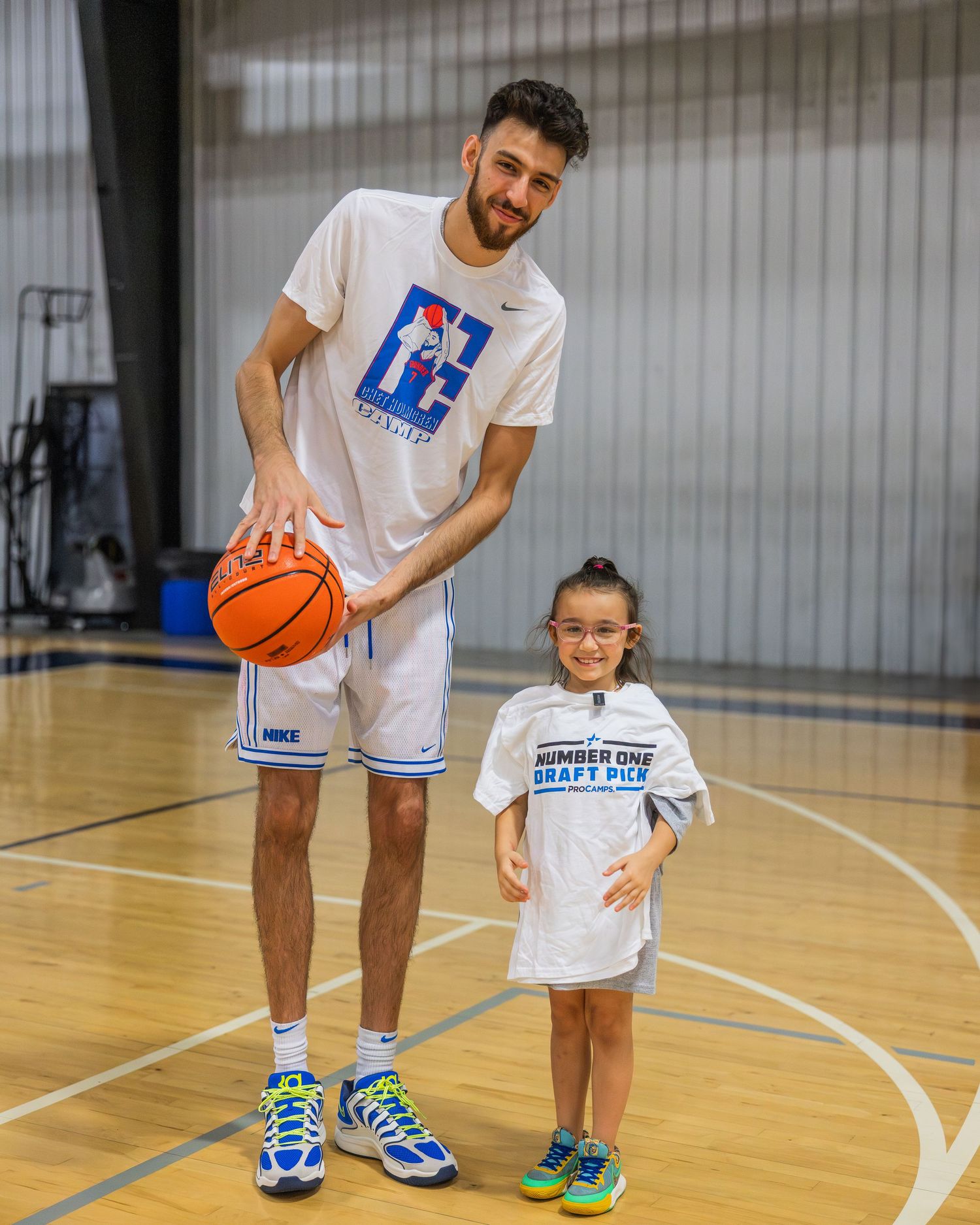 Chet Holmgren poses with the number one draft pick at his ProCamp in Oklahoma City.