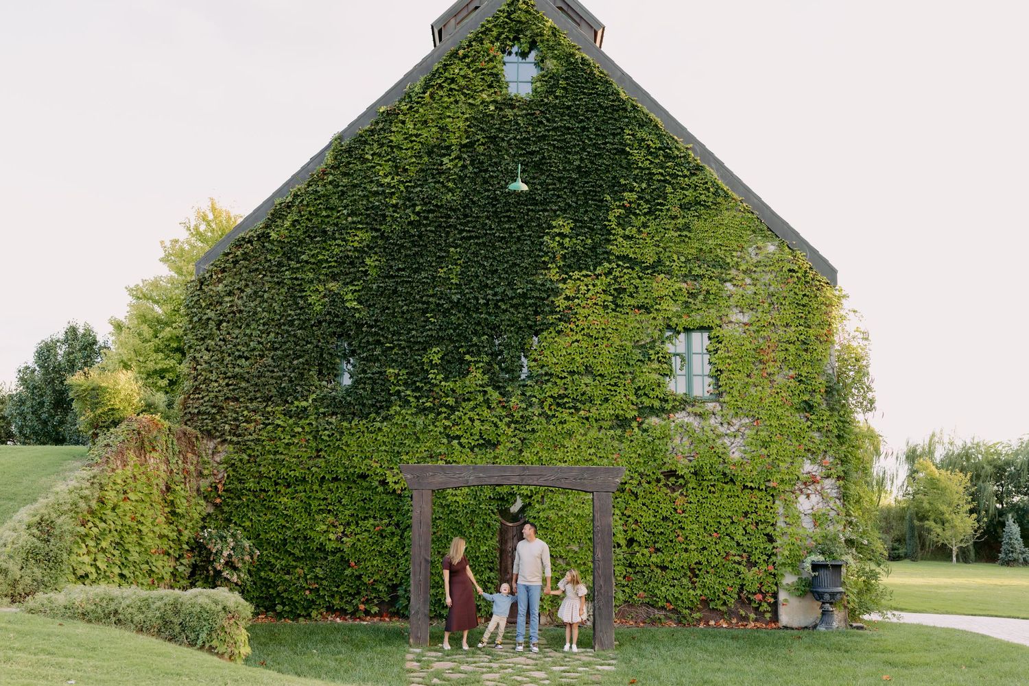 A series of photos showing a large ivy-covered church building with a cross visible through the greenery.