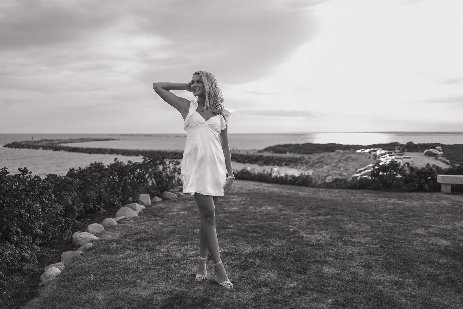 A series of black and white coastal landscape photographs showing rocky shores and dramatic seaside cliffs.