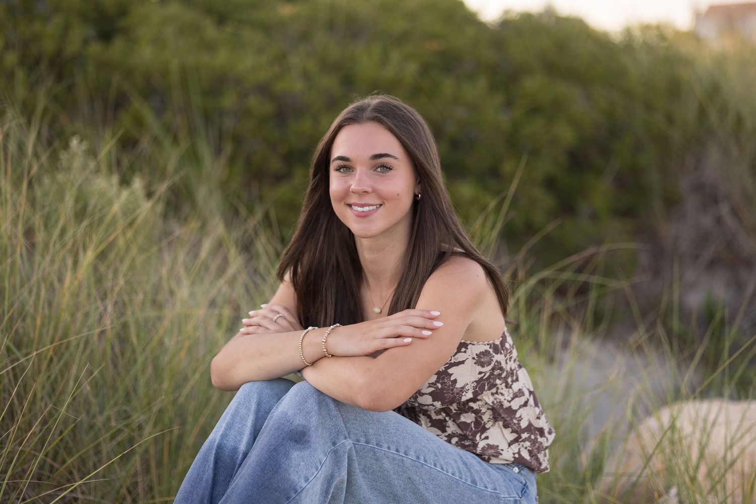A series of outdoor portrait photos featuring a person in casual attire against a natural beach grass background at sunset.