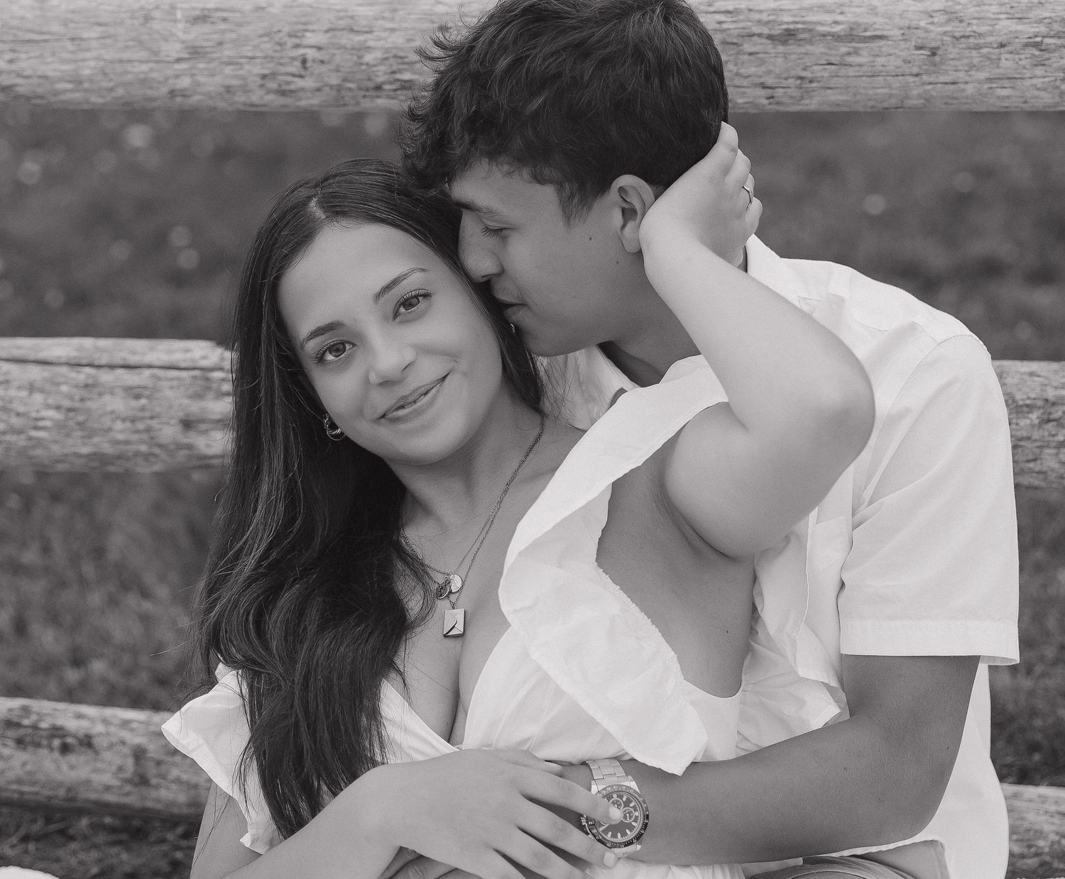 A romantic black and white photo sequence showing a couple embracing and sharing tender moments on a bench.