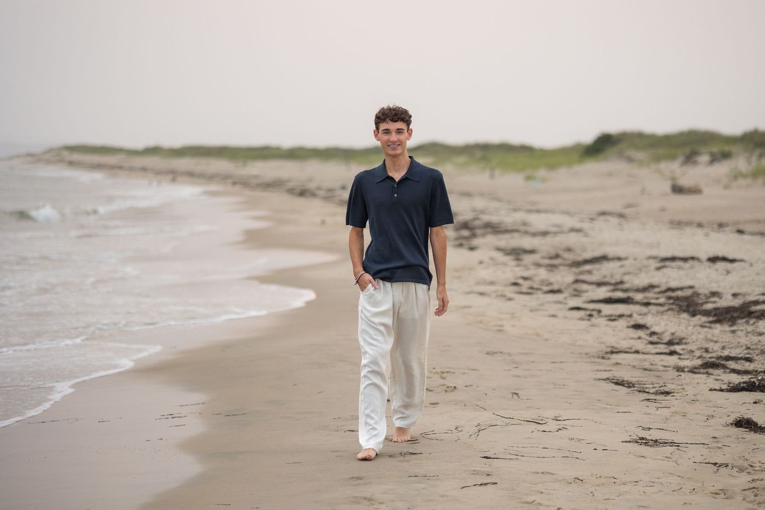 A sequence of beach walking photos showing footprints in the sand along a scenic shoreline.