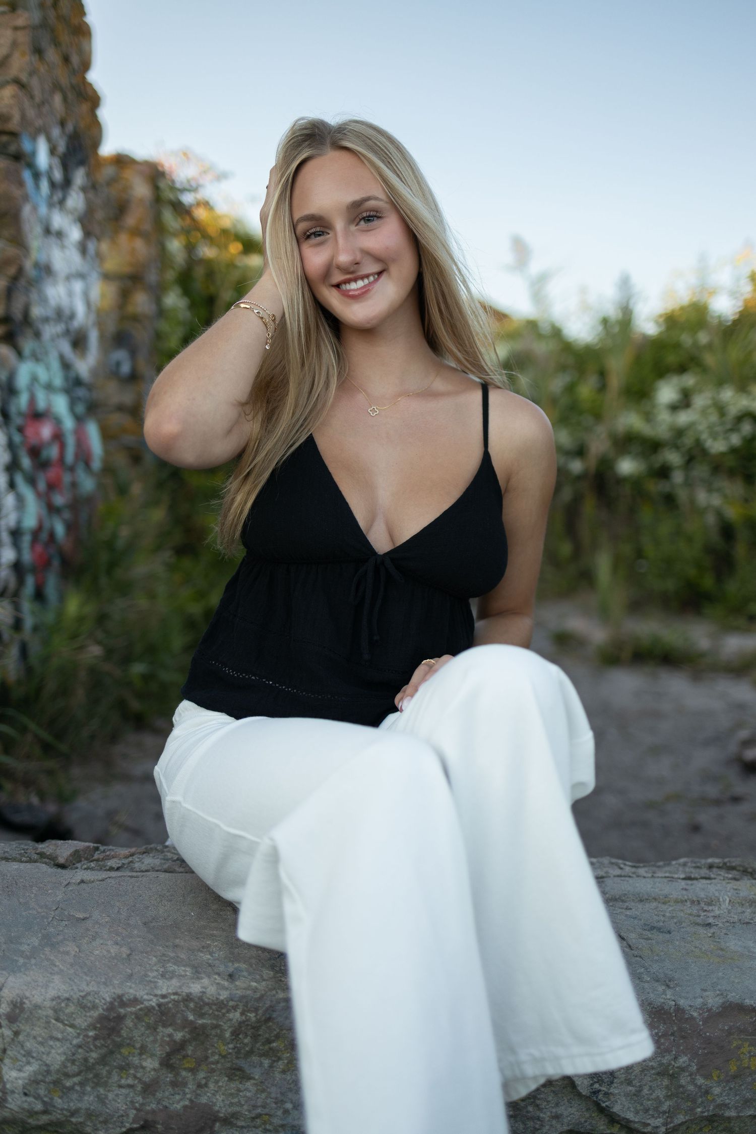 Casual summer fashion portrait at historic stone ruins location.
