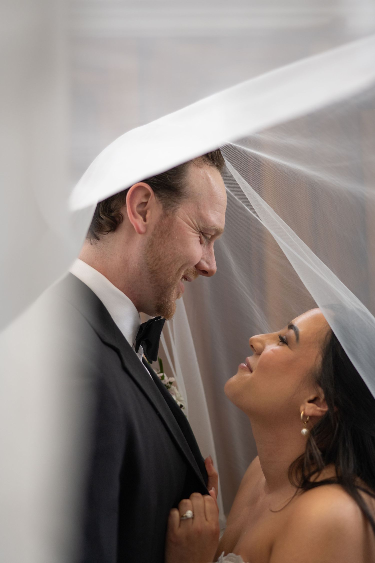 Romantic wedding photography sequence showing couple under bridal veil.