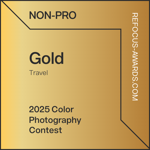 Gold award badge for Travel category in the 2025 Color Photography Contest for non-professional photographers.