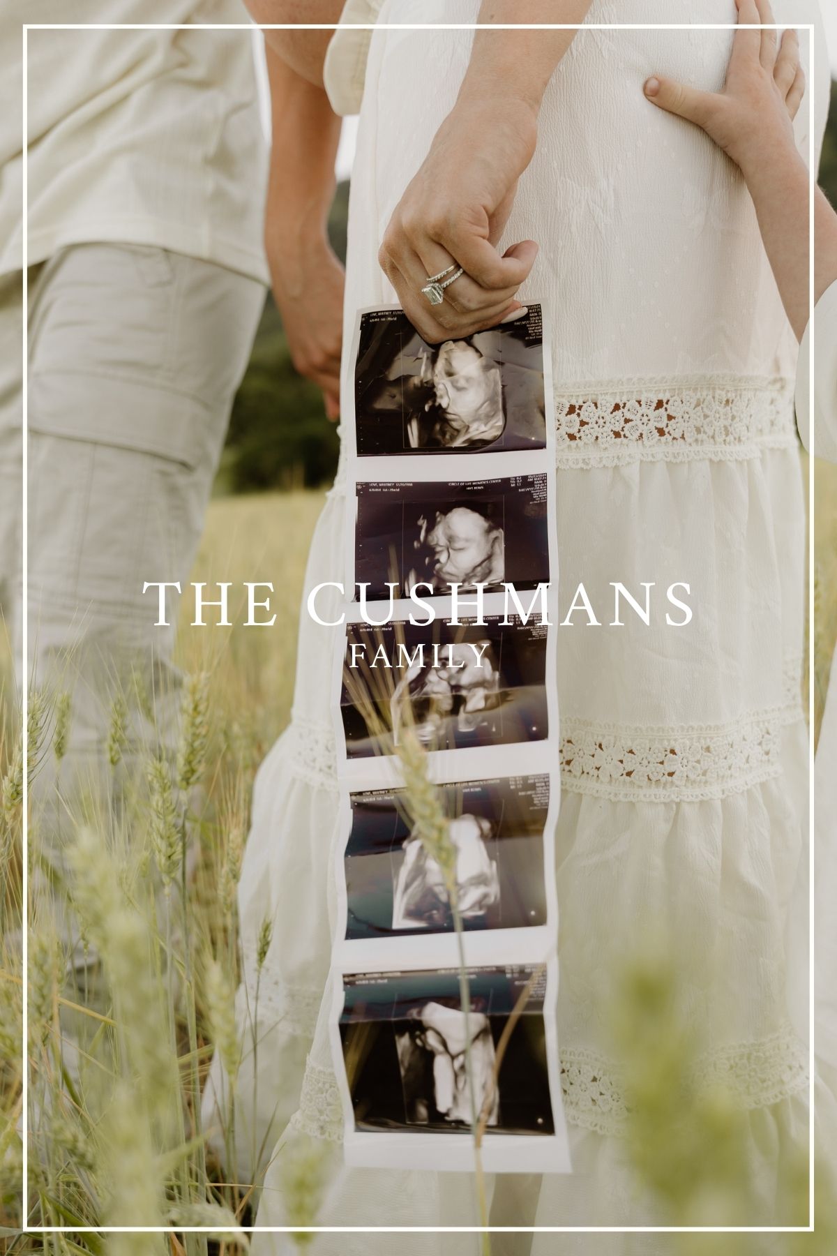 A vintage-style photo strip hangs against a white lace dress in a sunlit meadow with tall grass.