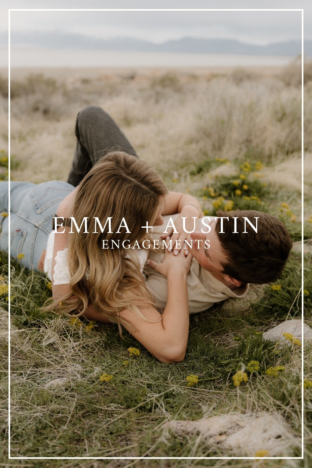 A romantic engagement photo shows a couple lying in tall grass with mountains in the background at sunset.
