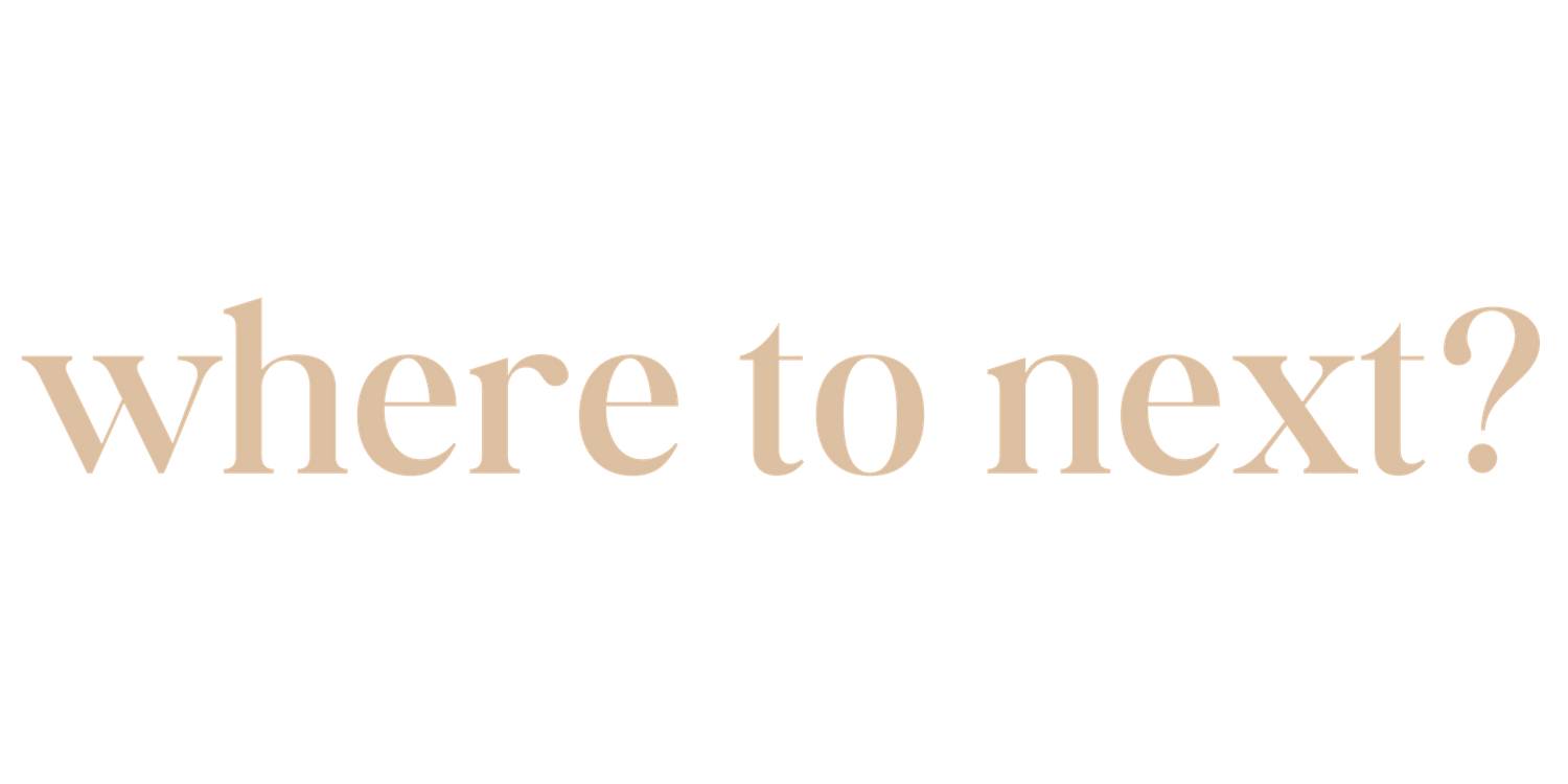 Rose gold text reading 'where to next?' on a dark background.