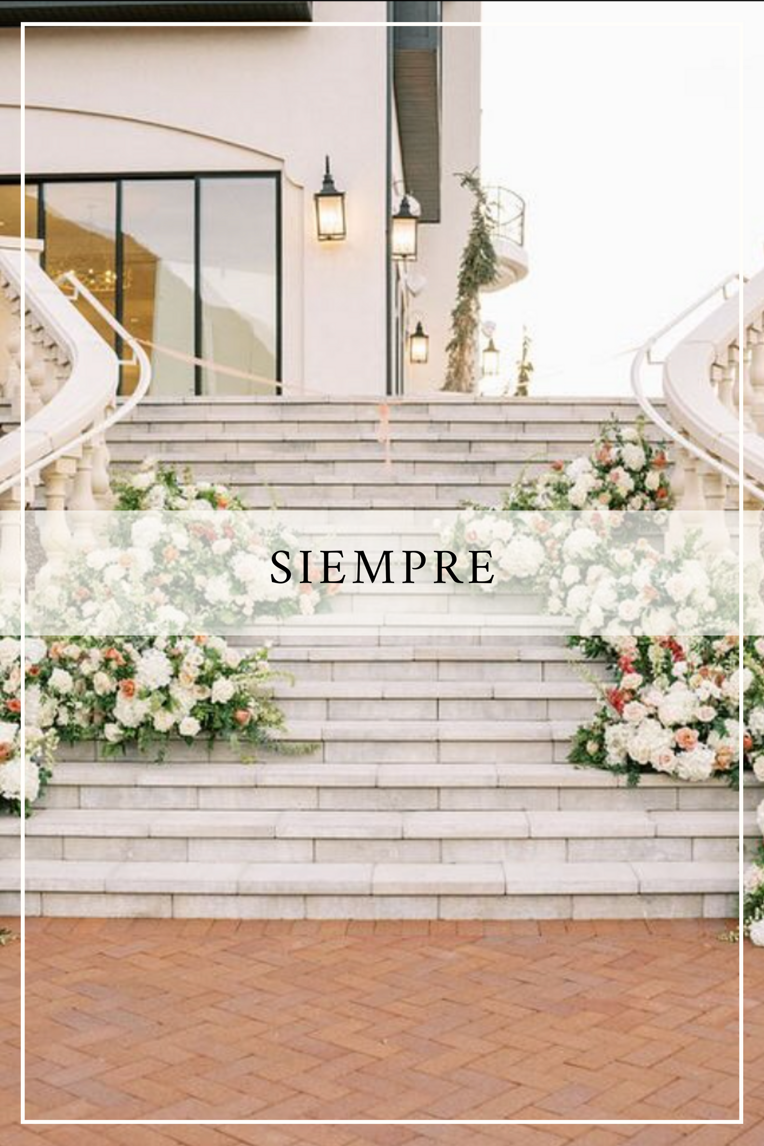 Elegant stone stairs decorated with white floral arrangements and the word 'SIEMPRE' at an outdoor venue entrance.