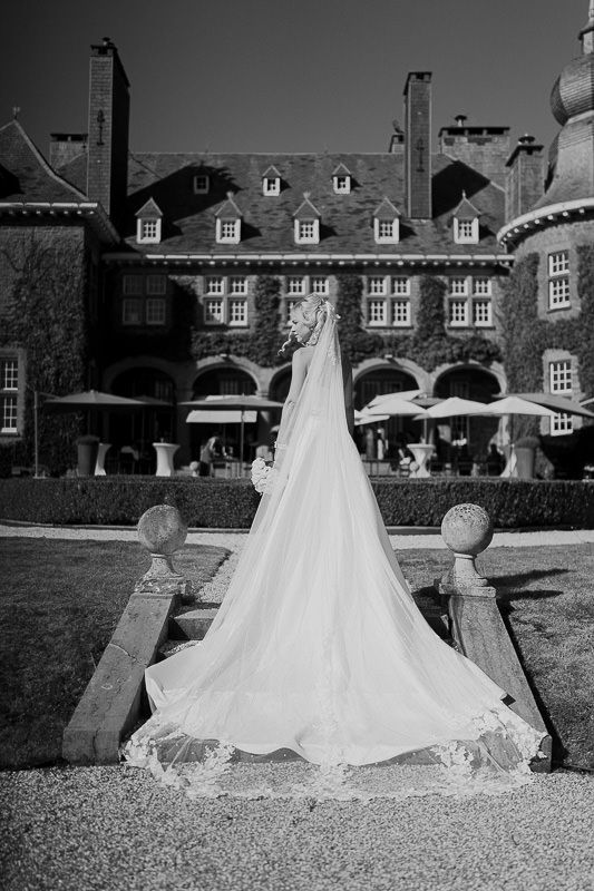 Bride on stairs of Manoir de Lébioles castle