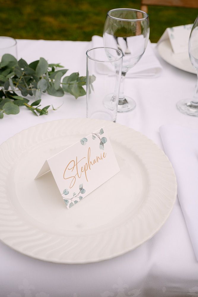 Elegant wedding table setting with a name card on a plate at Kasteel Aerwinkel.