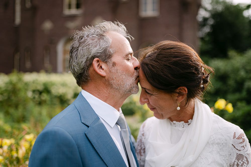 Emotional close-up portrait of the couple during their wedding at Kasteel Aerwinkel.