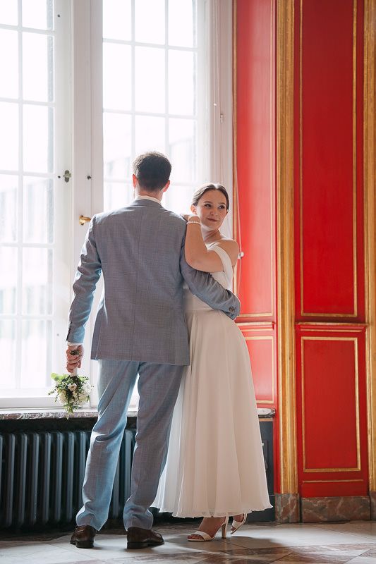 Intimate window-light moment in the Red Room, City Hall.