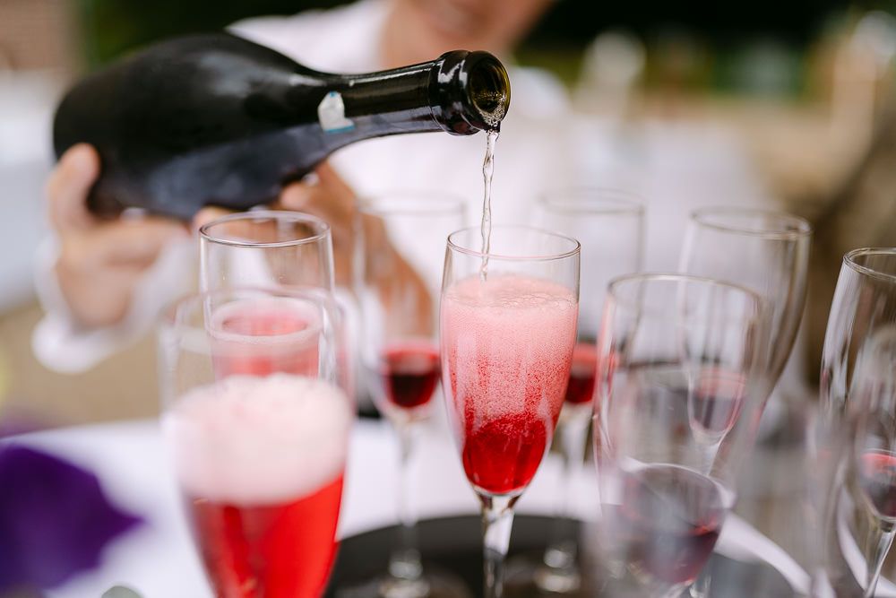 Champagne being poured into glasses during wedding celebrations at Kasteel Aerwinkel.