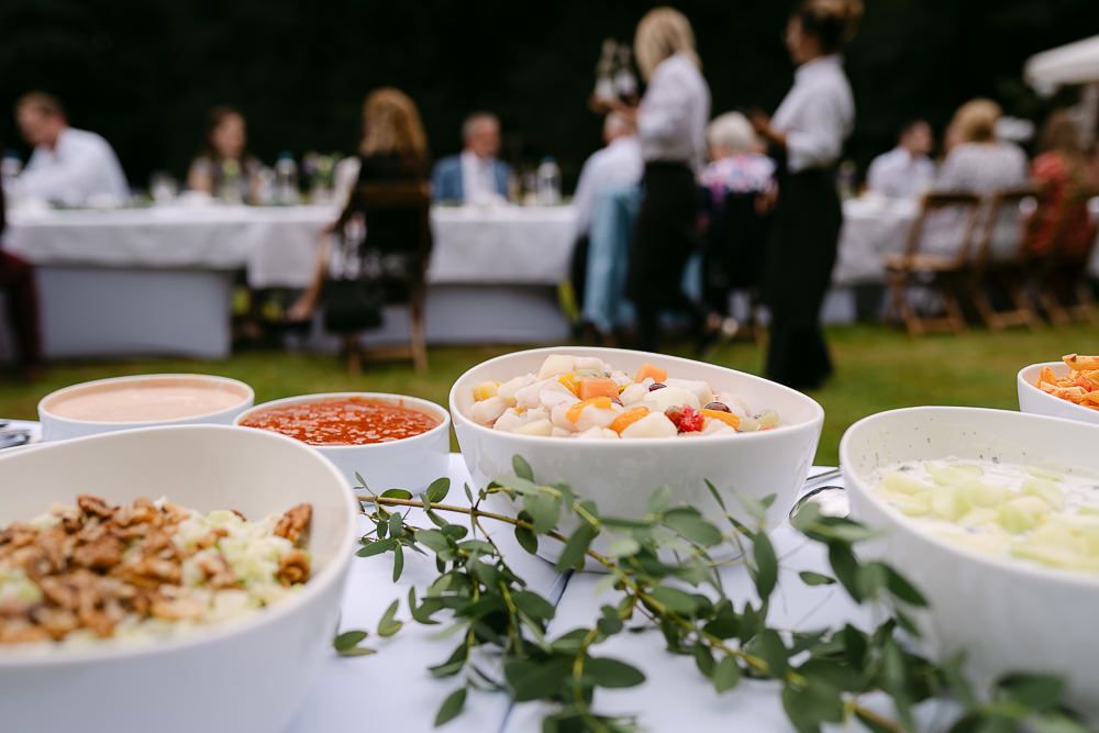 Wedding buffet table with salads and side dishes at Kasteel Aerwinkel.