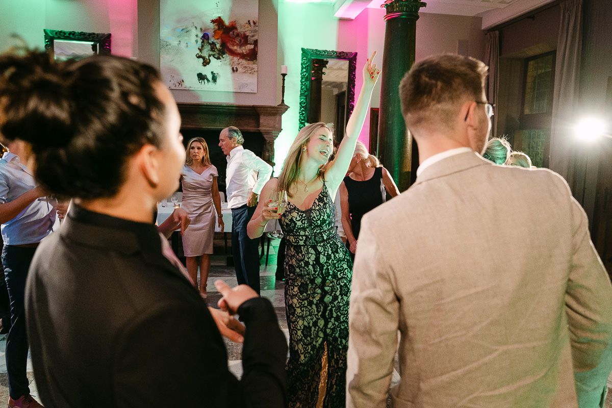 Guests dancing on dancefloor during party at Manoir de Lébioles