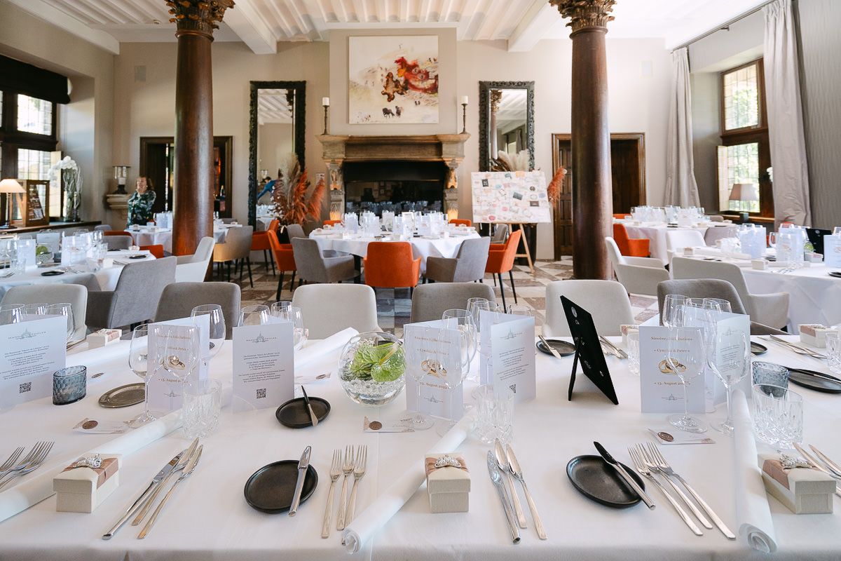 Elegant dining hall inside Manoir de Lébioles wedding venue