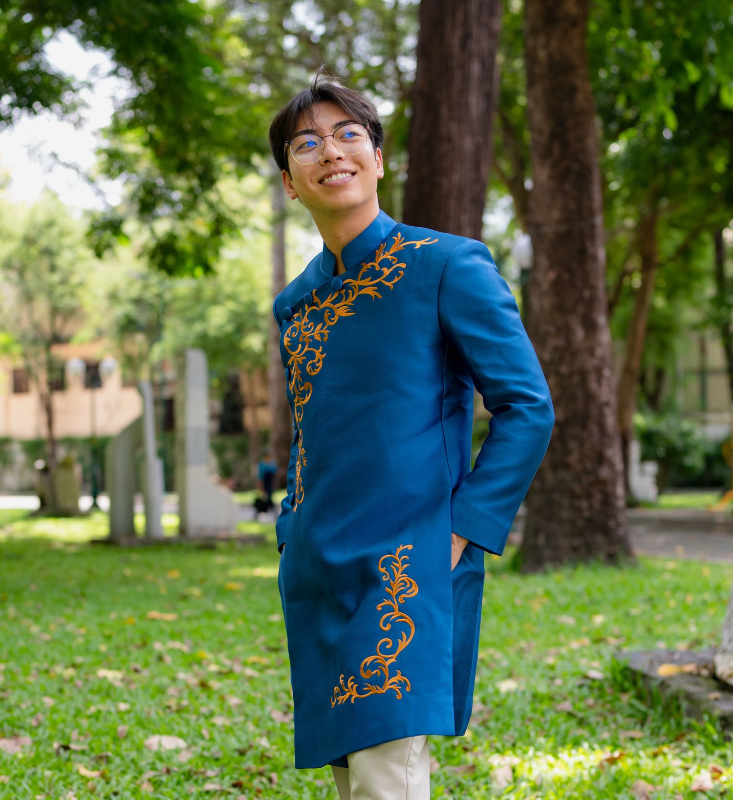 A portrait of Anh-Viet Dinh wearing an ao dai in Vietnam.