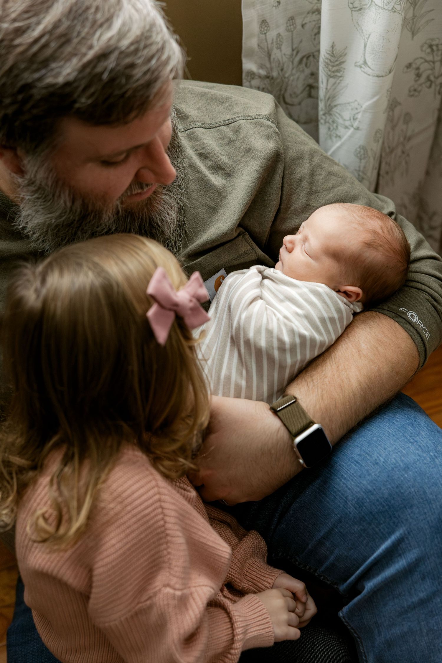 A tender moment between parent and child as they cuddle together on a couch in a sequence of intimate photos.