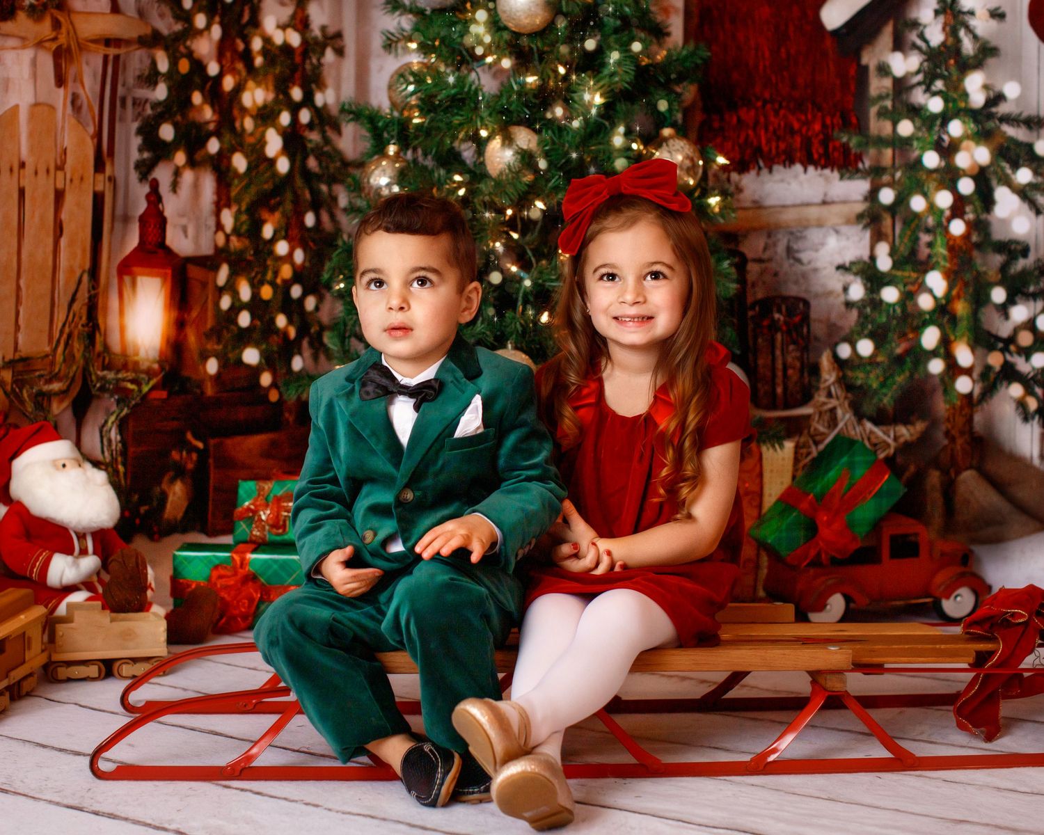 Bergen County Family studio Photographer siblings in studio by Christmas tree
