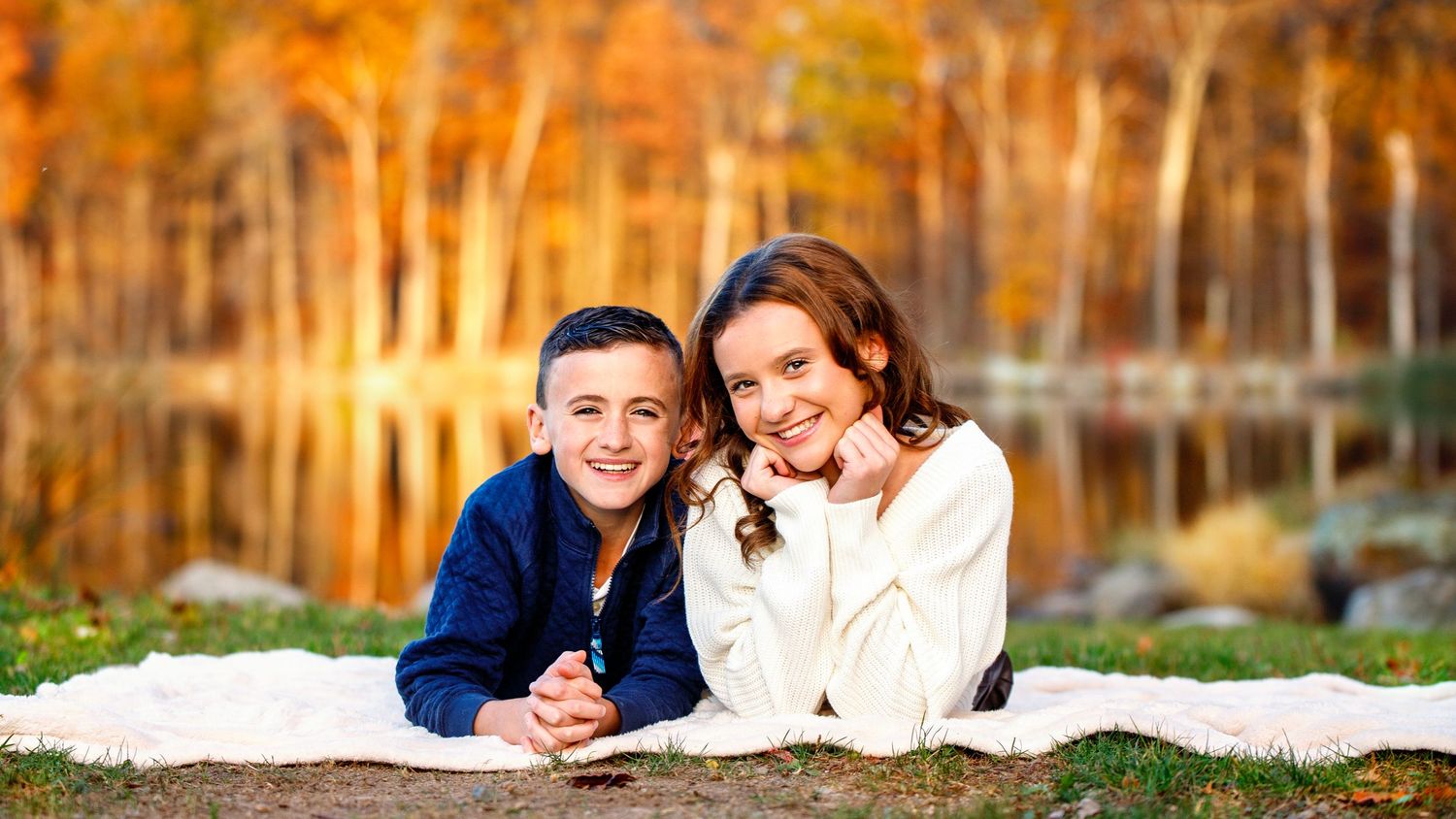 family photographer bergen county nj outdoor siblings on blanket near lake
