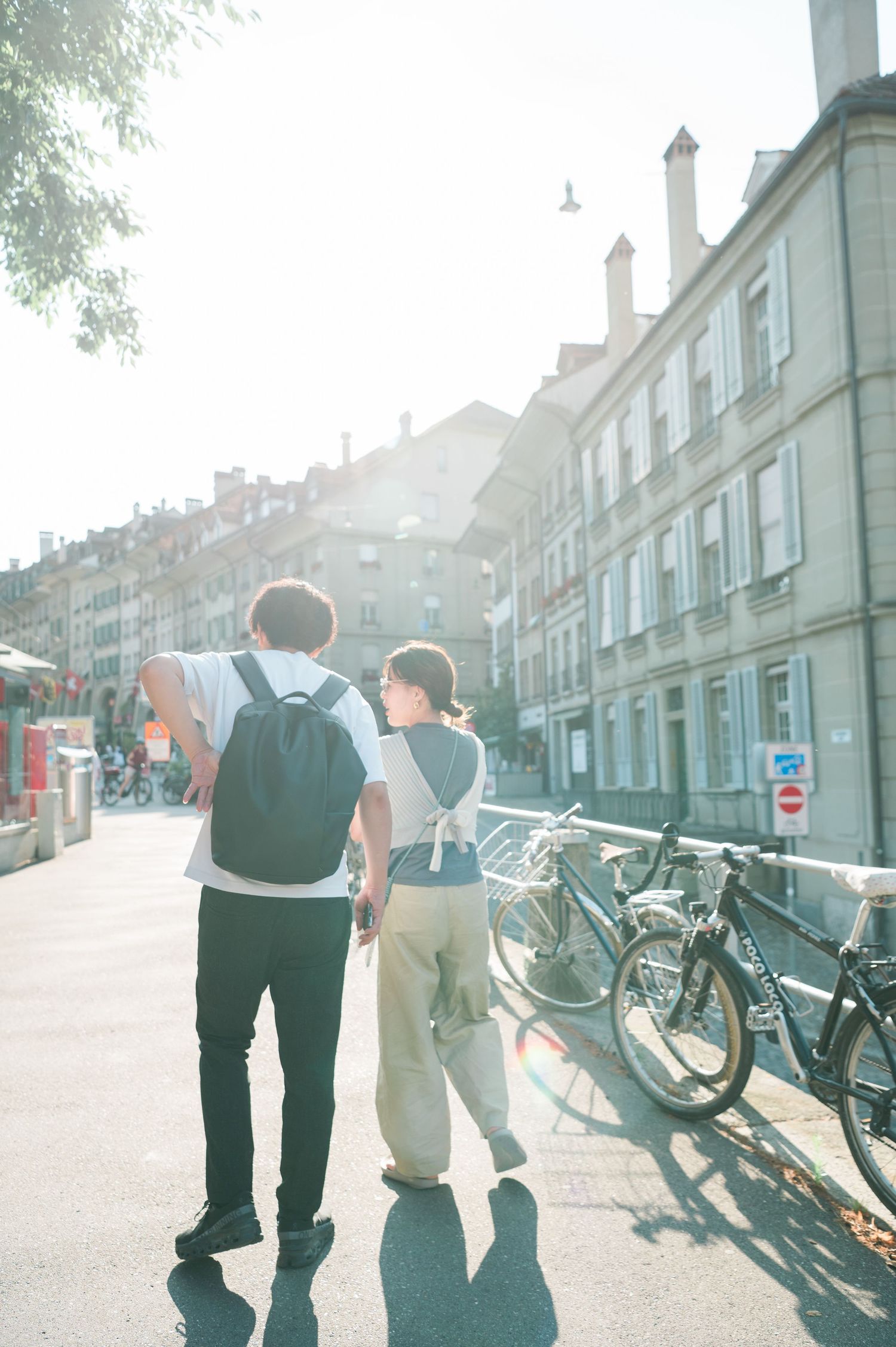 Couple walking together along a charming European street
