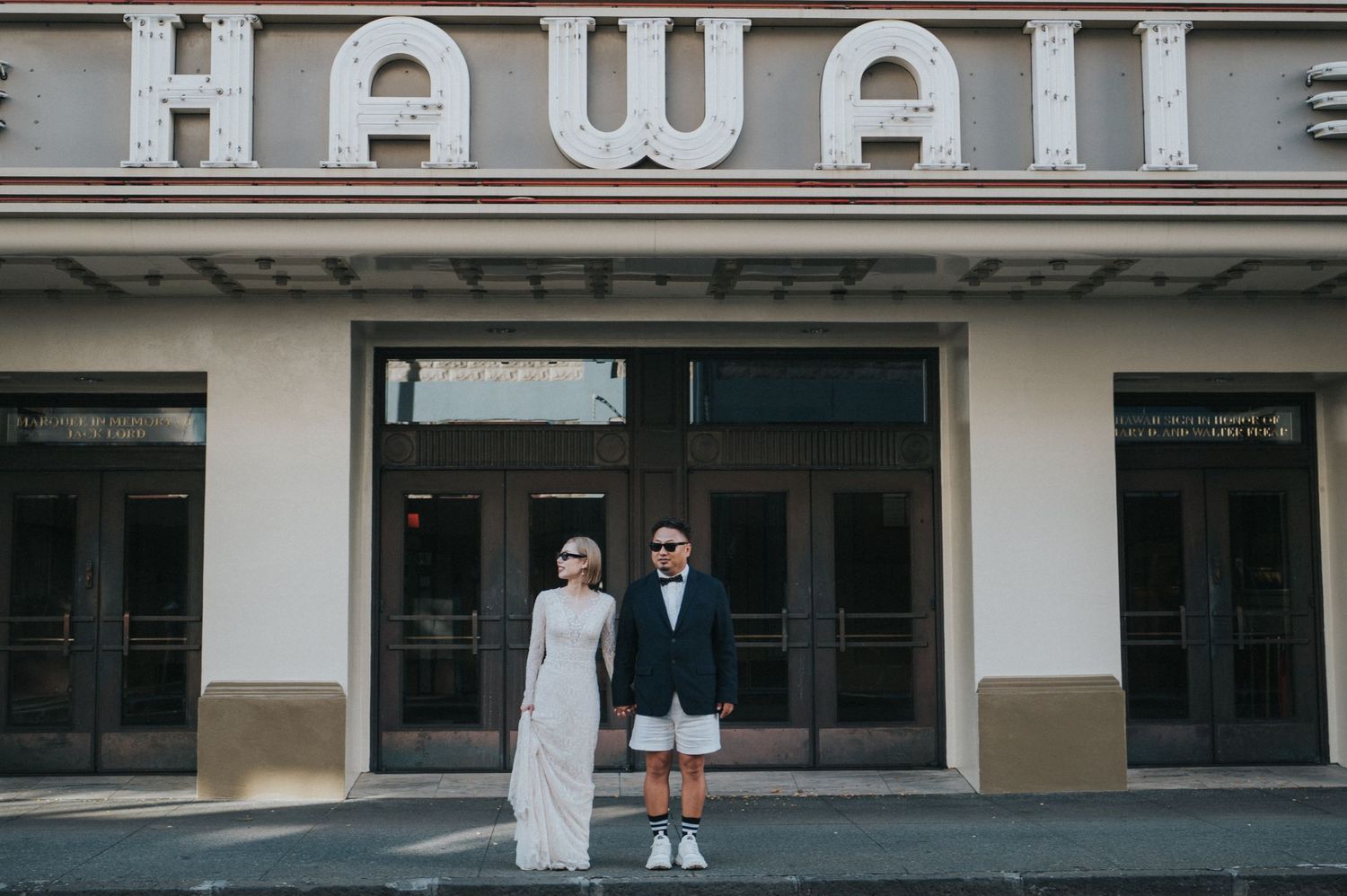 Newlywed couple outside the Hawaii Theatre in downtown Honolulu