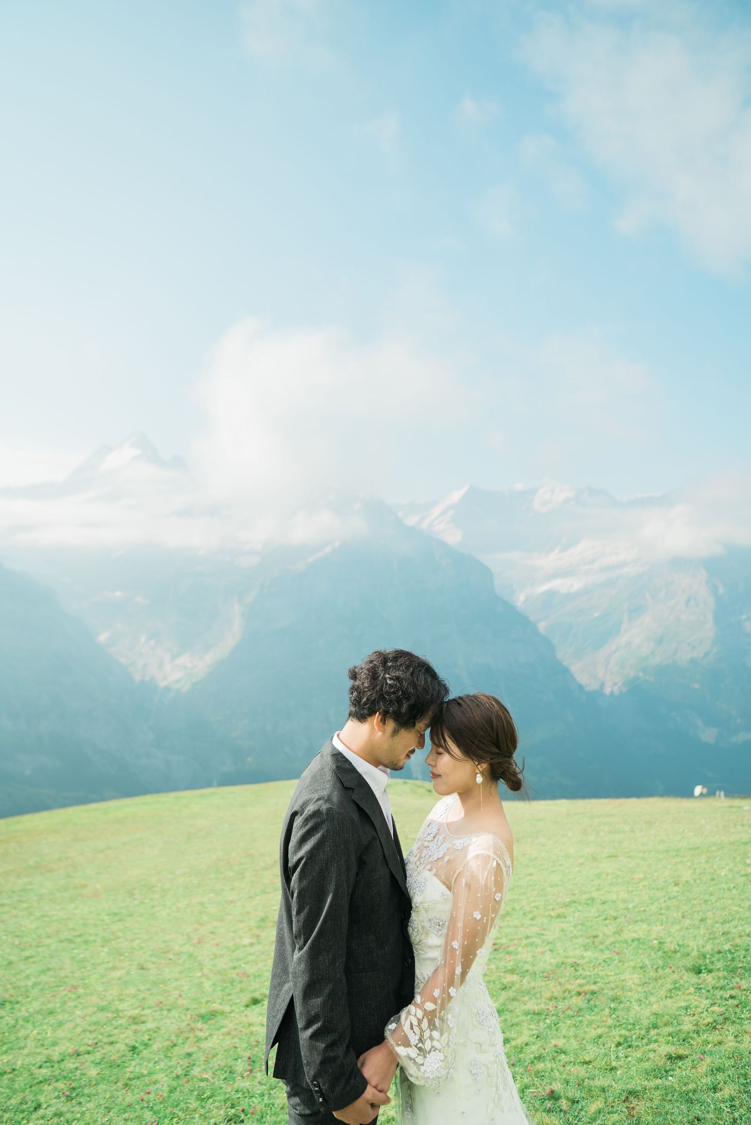 Newlywed couple embracing in the Swiss Alps during a destination wedding in Switzerland