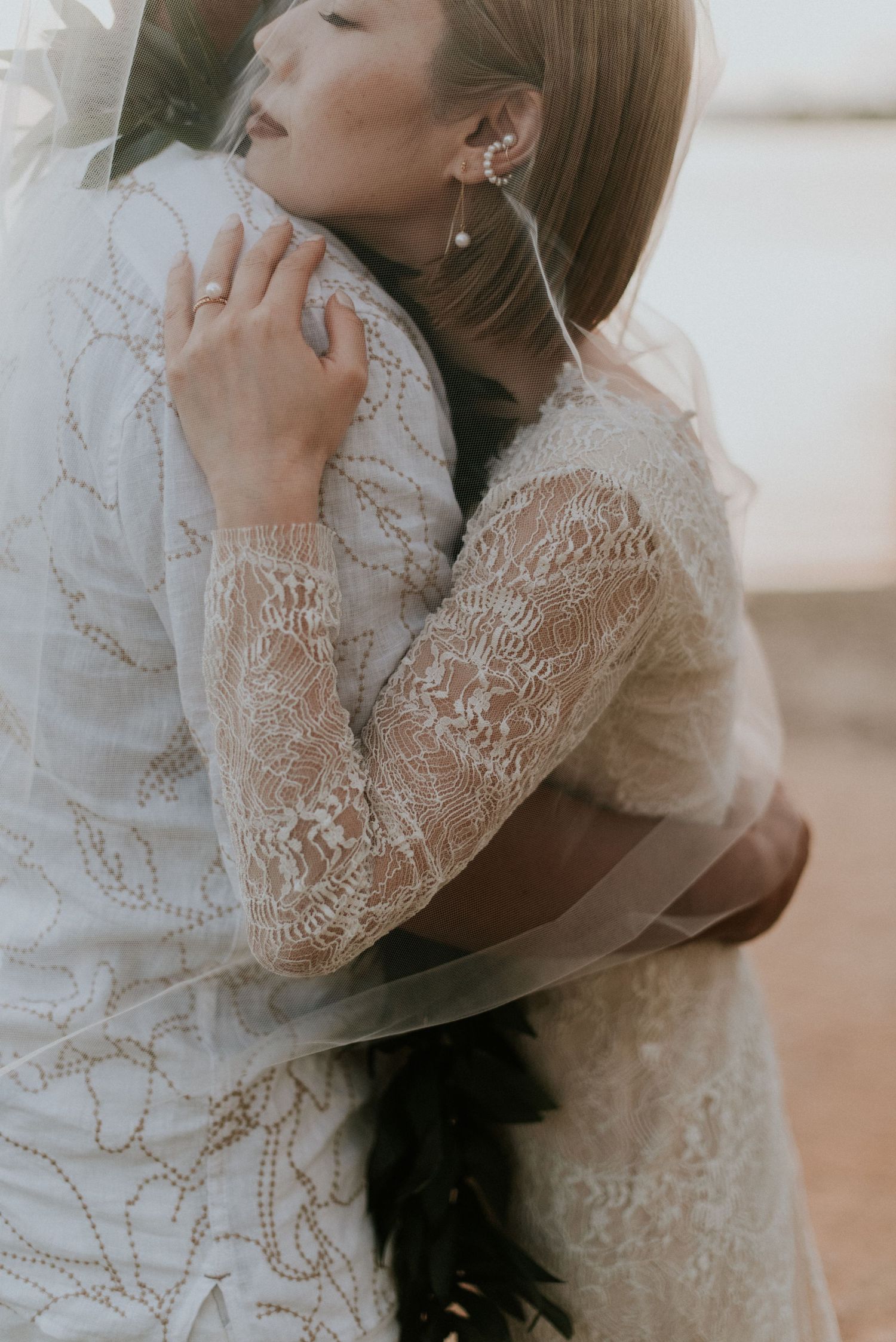 ride and groom sharing a quiet embrace during their Hawaii wedding