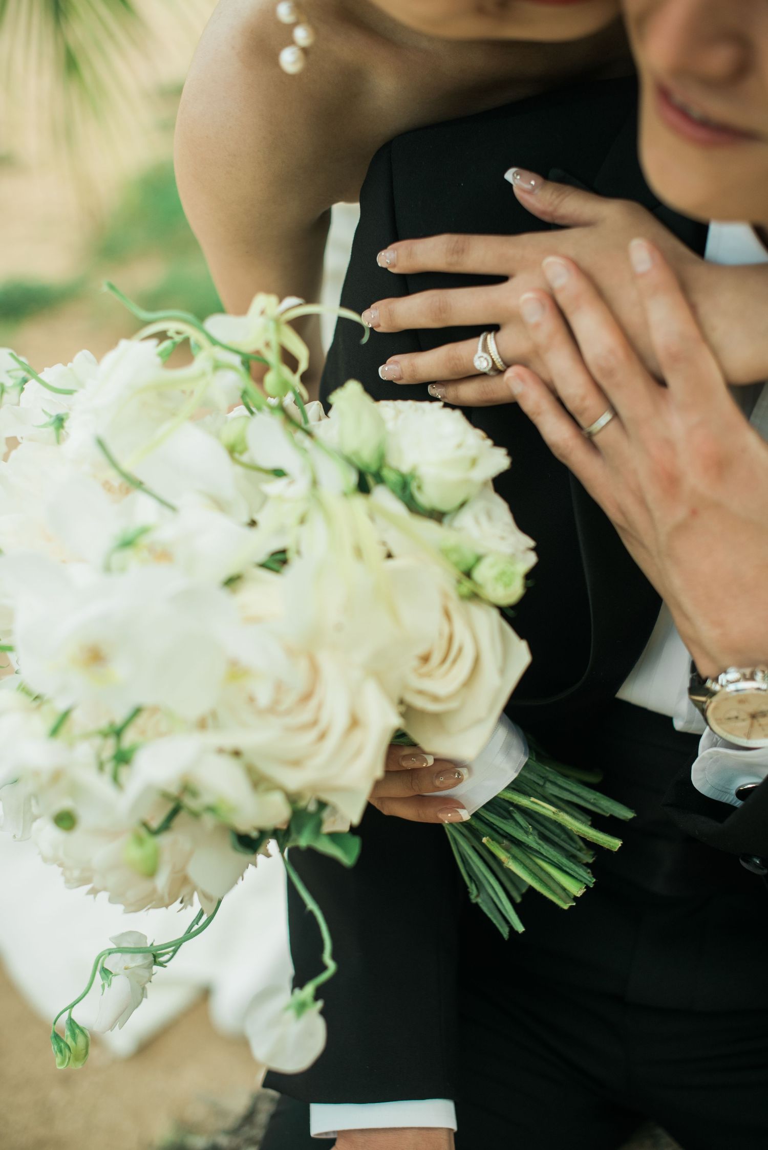 Bride holding a white wedding bouquet during a quiet portrait moment