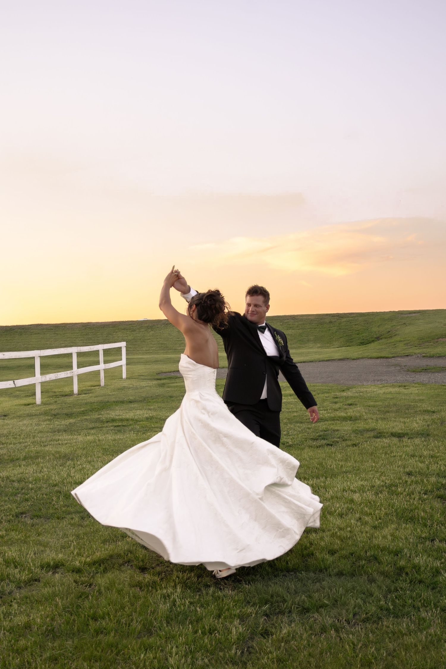 golden hour bride and groom portrait, romantic wedding photos, warm, princess twirl