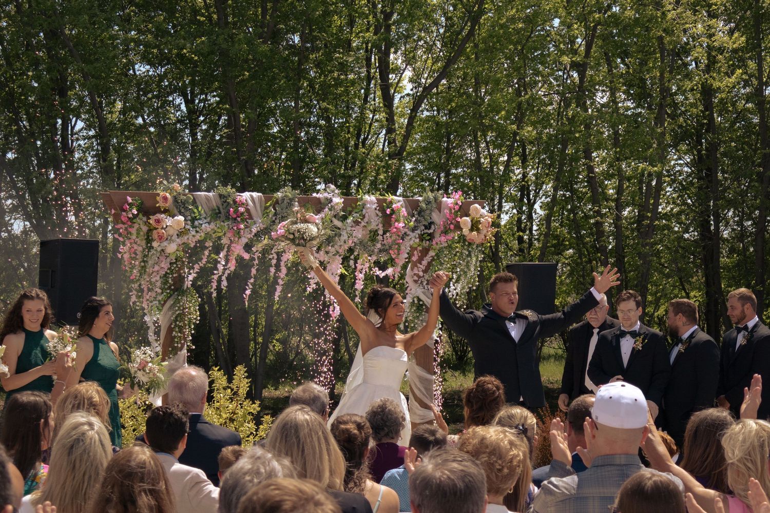 Wedding celebration, pink florals, outdoor ceremony