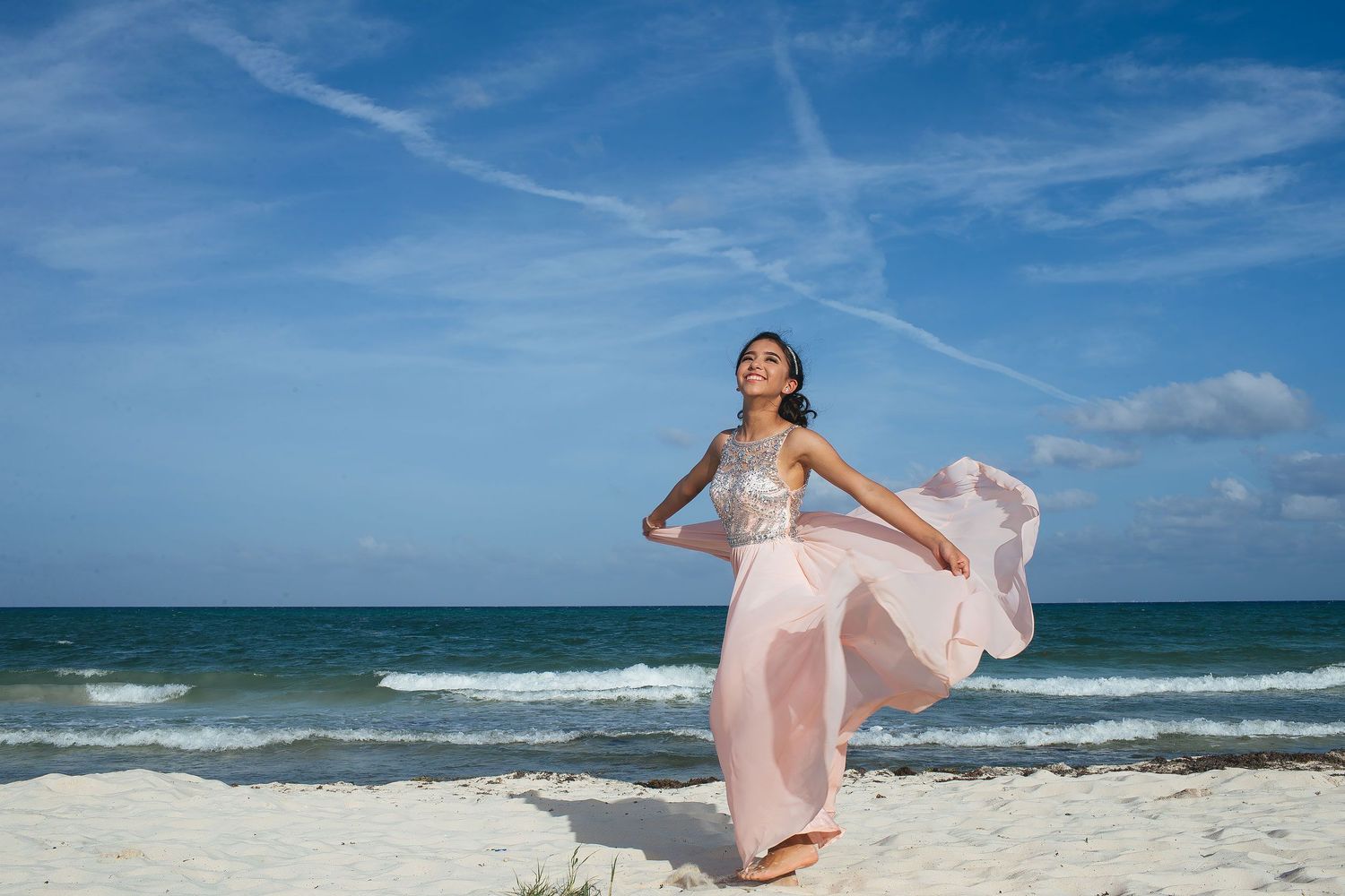 Sweet 15 portrait session in Puerto Morelos with a blush pink gown, ocean views, and tropical beach scenery.
