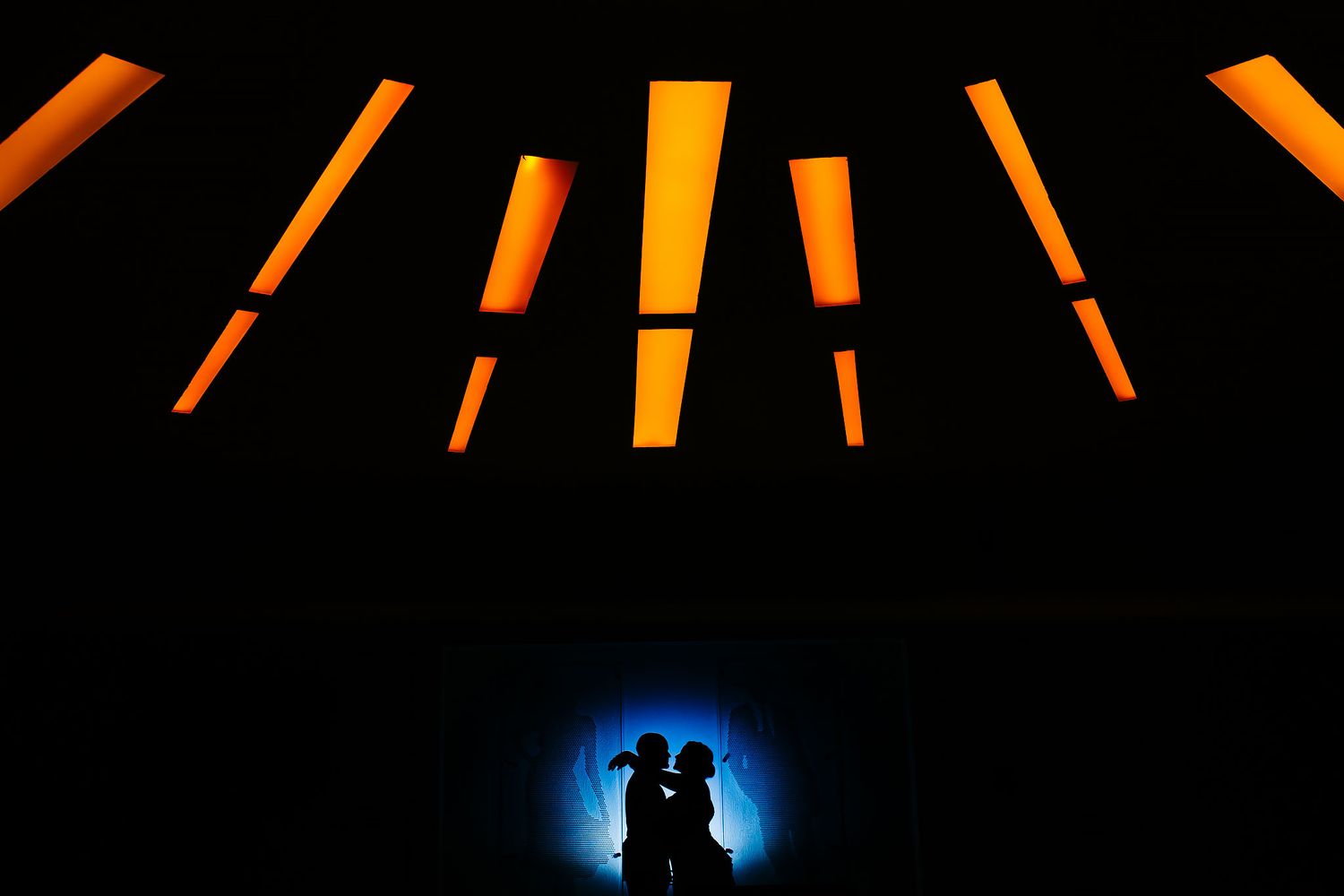 Creative wedding silhouette portrait at Nizuc Resort Cancun with dramatic lighting and artistic composition in the Riviera Maya.