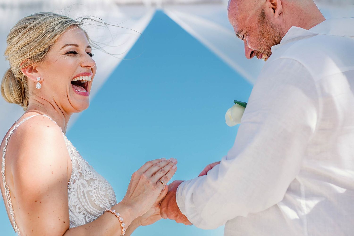 Joyful bride at Finest Playa Mujeres wedding ceremony. Professional destination wedding photography for authentic candid moments.
