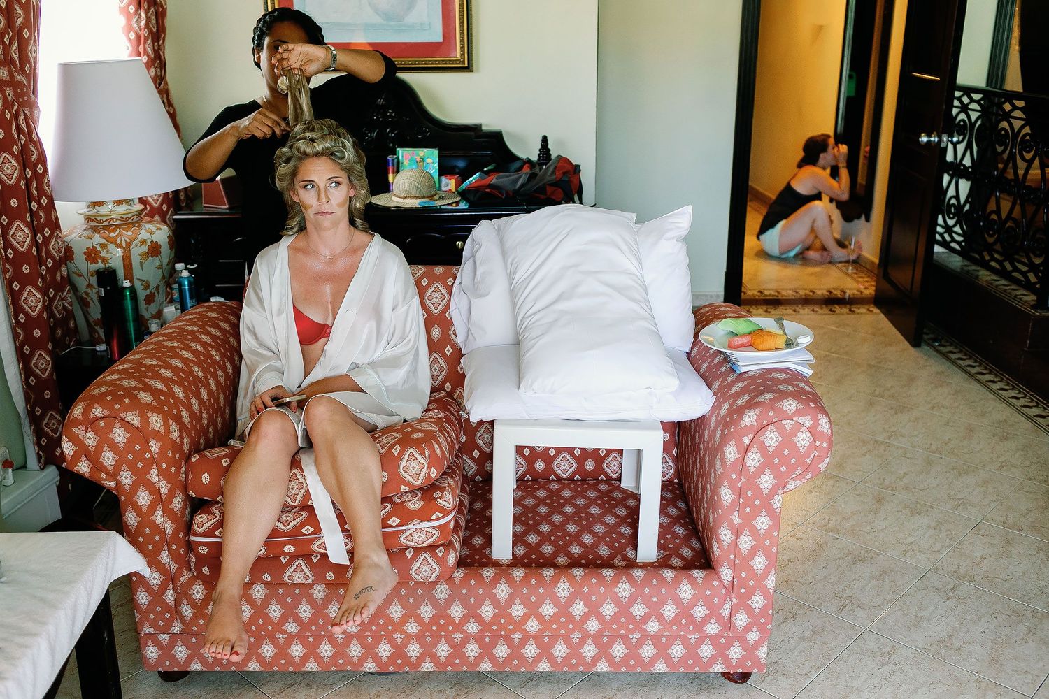 Bride having her bridal hair styled inside her room at Riu Palace Riviera Maya in Playacar, Playa del Carmen.