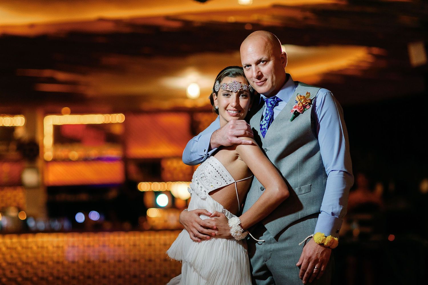Juliana and Tom pose together during their reception at Fragata Beach Club.