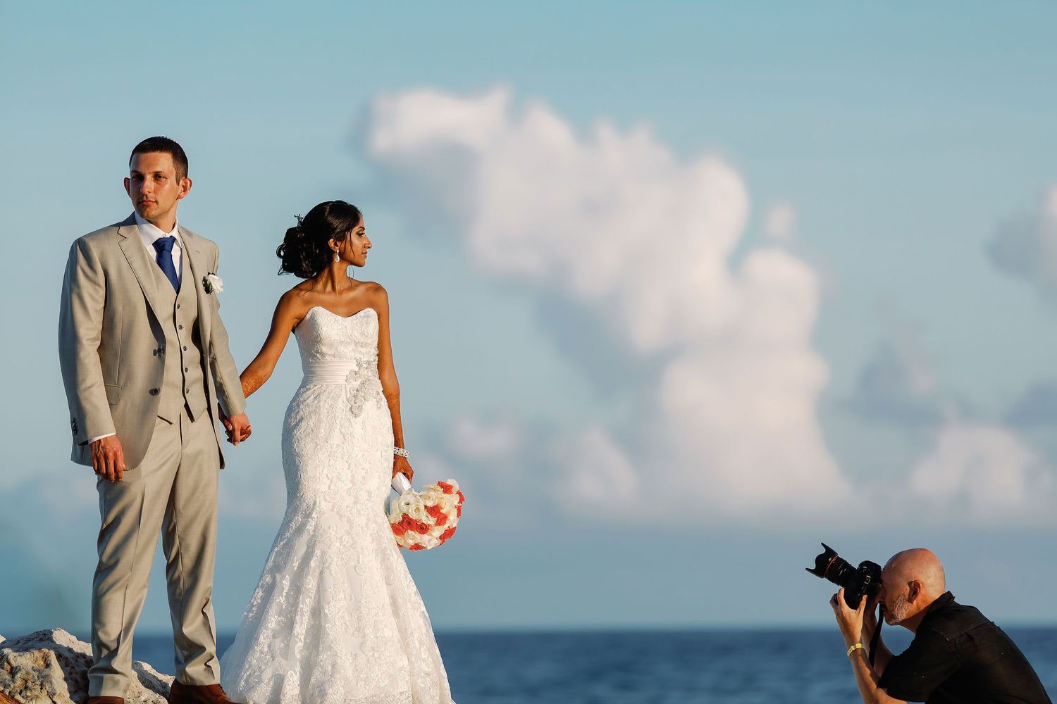 Ivan Luckie photographing a bride and groom at Hard Rock Riviera Maya during a destination wedding portrait session.
