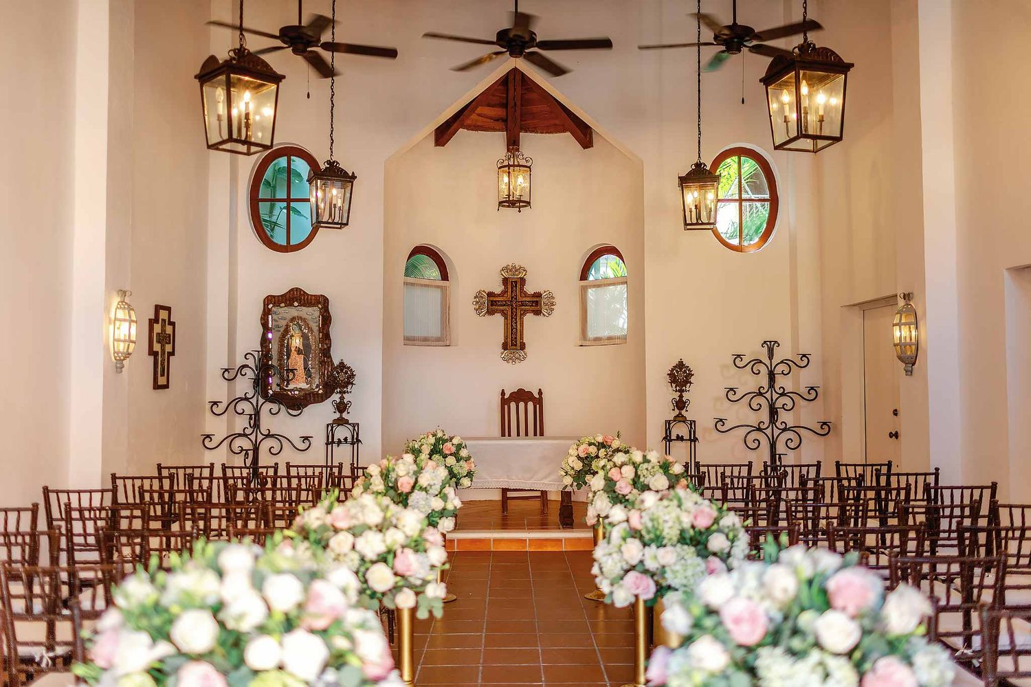 Catholic wedding chapel interior at Dreams Tulum Resort with floral aisle setup and altar, elegant ceremony venue in Tulum Mexico