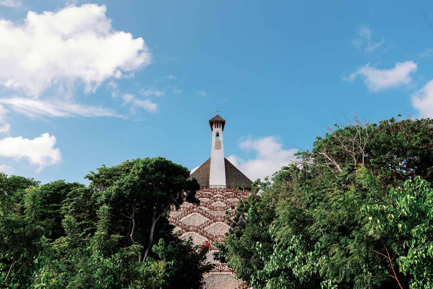 All Ángeles Chapel at Hotel Xcaret Mexico surrounded by lush jungle, a top Catholic wedding venue in Riviera Maya for destination weddings
