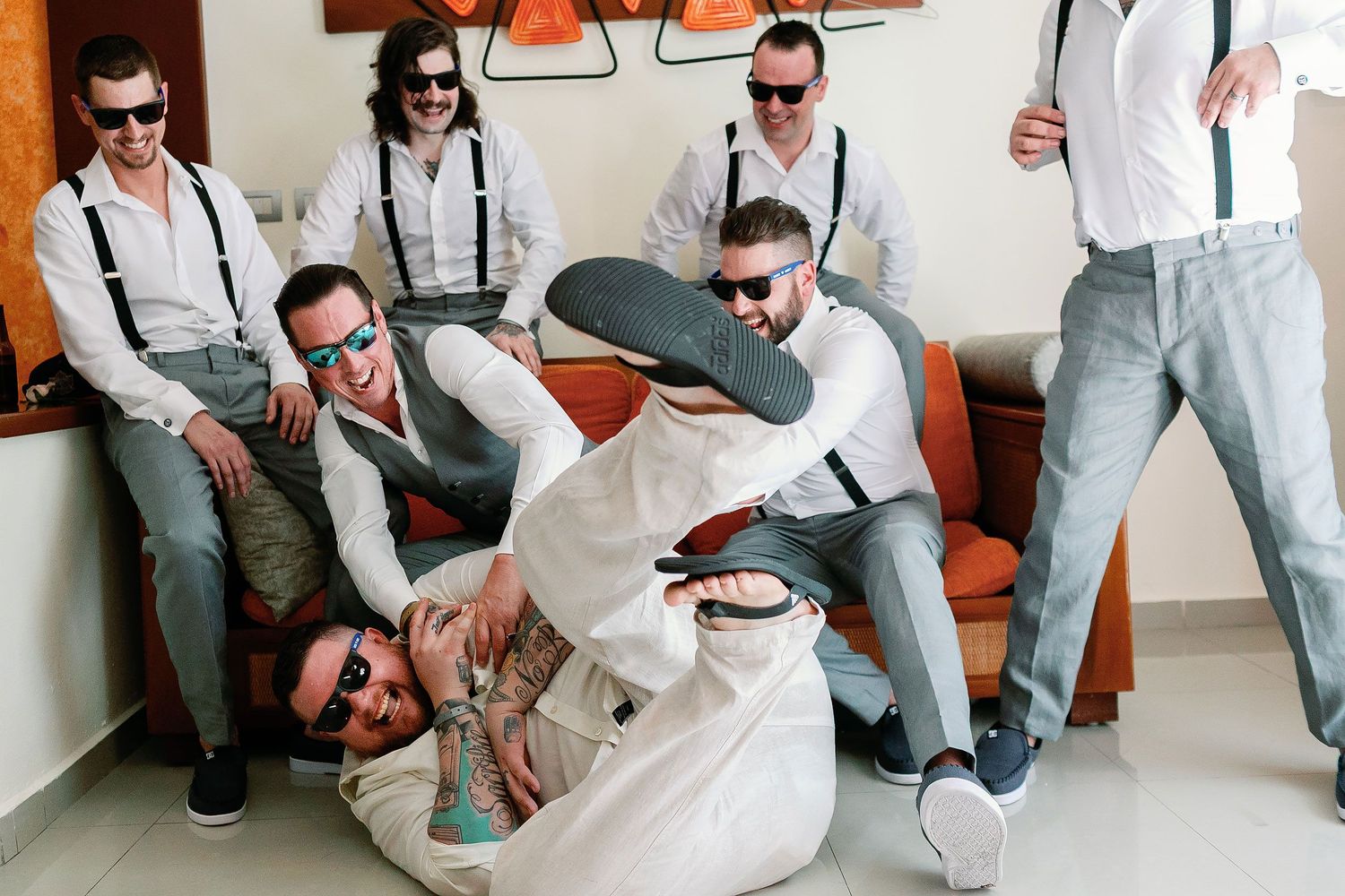 Scott and his groomsmen laughing during wedding preparations