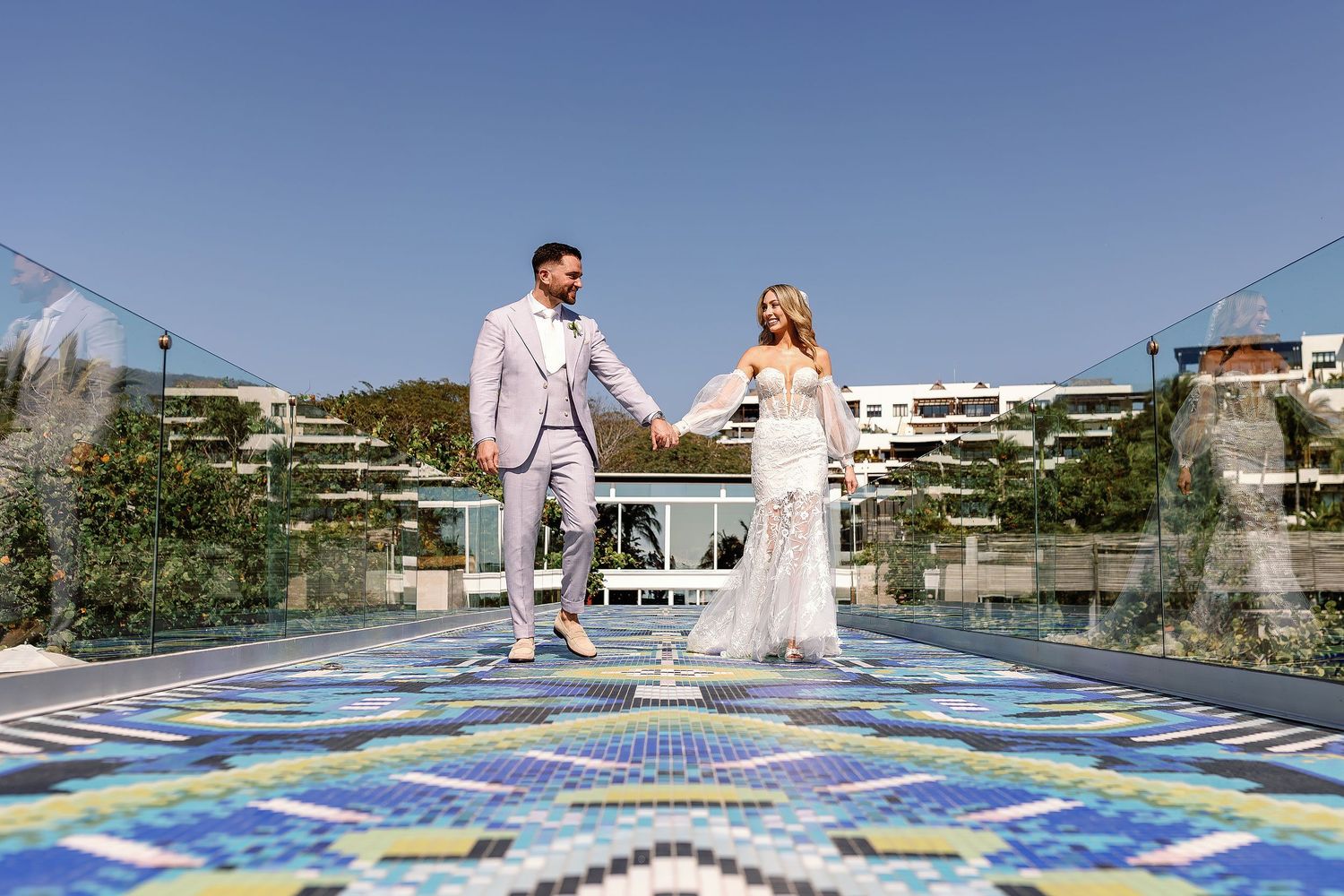 Elegant wedding couple portrait on the signature walkway at W Punta de Mita, one of Mexico's premier luxury destination wedding resorts.