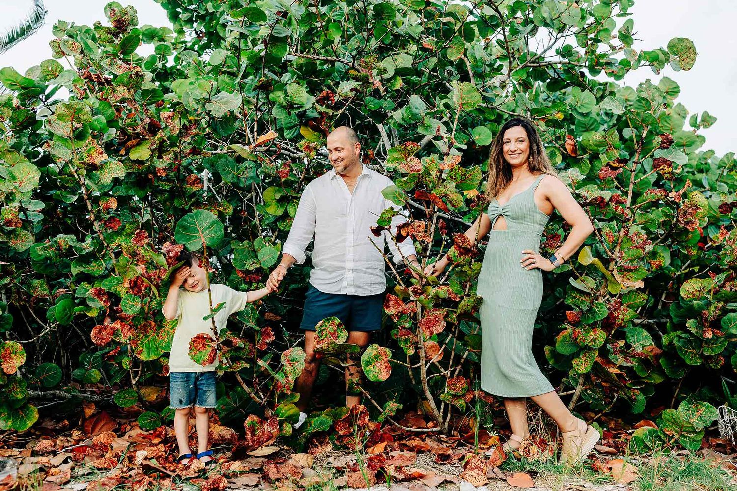 Family walking together during a fun and candid Playa del Carmen session