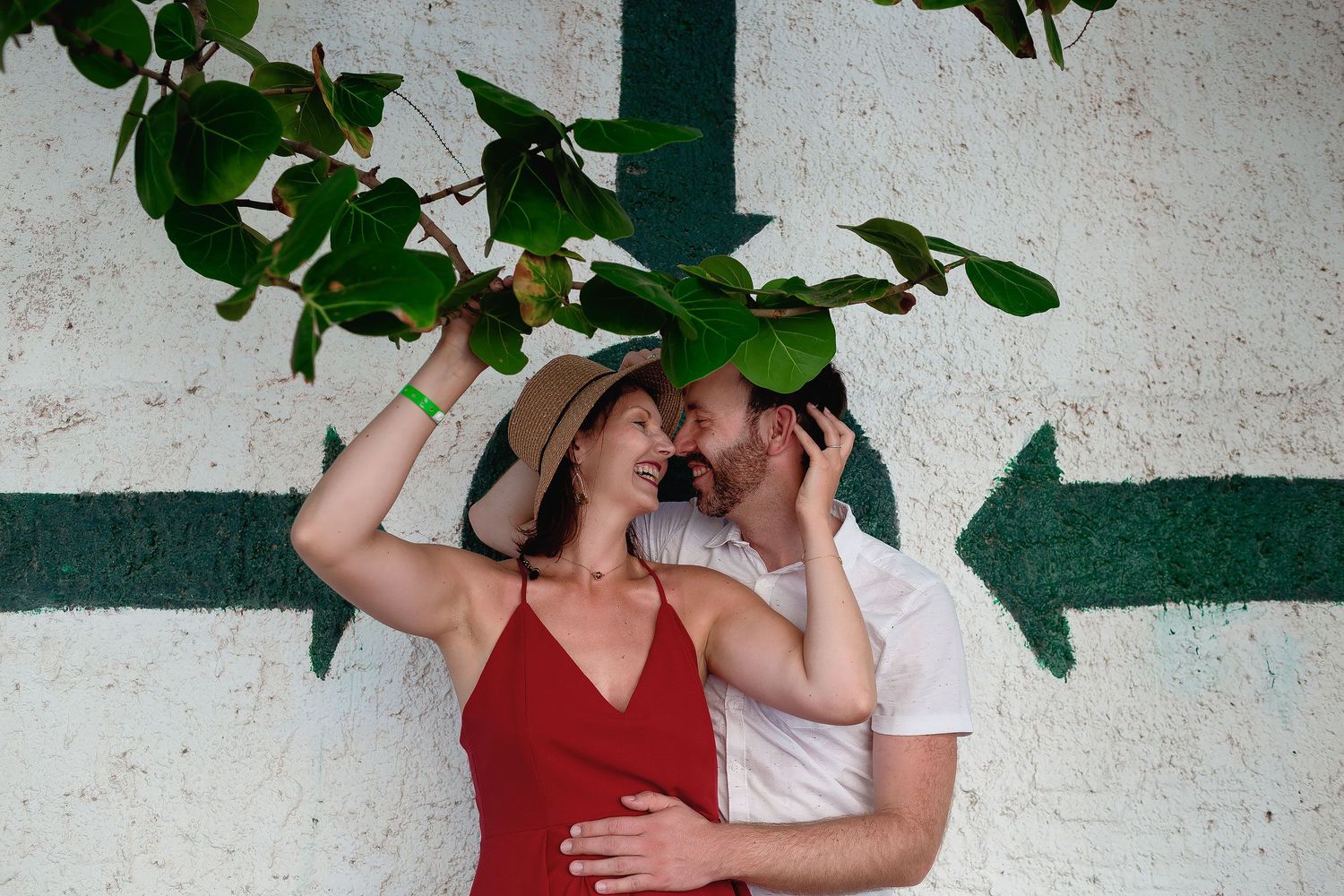 Couple laughing during a natural engagement photography session in Playa del Carmen in Mexico by Luckie Photography