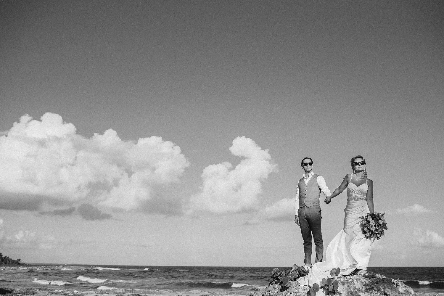 Black-and-white portrait of Carly and Scott on the Riviera Maya shoreline