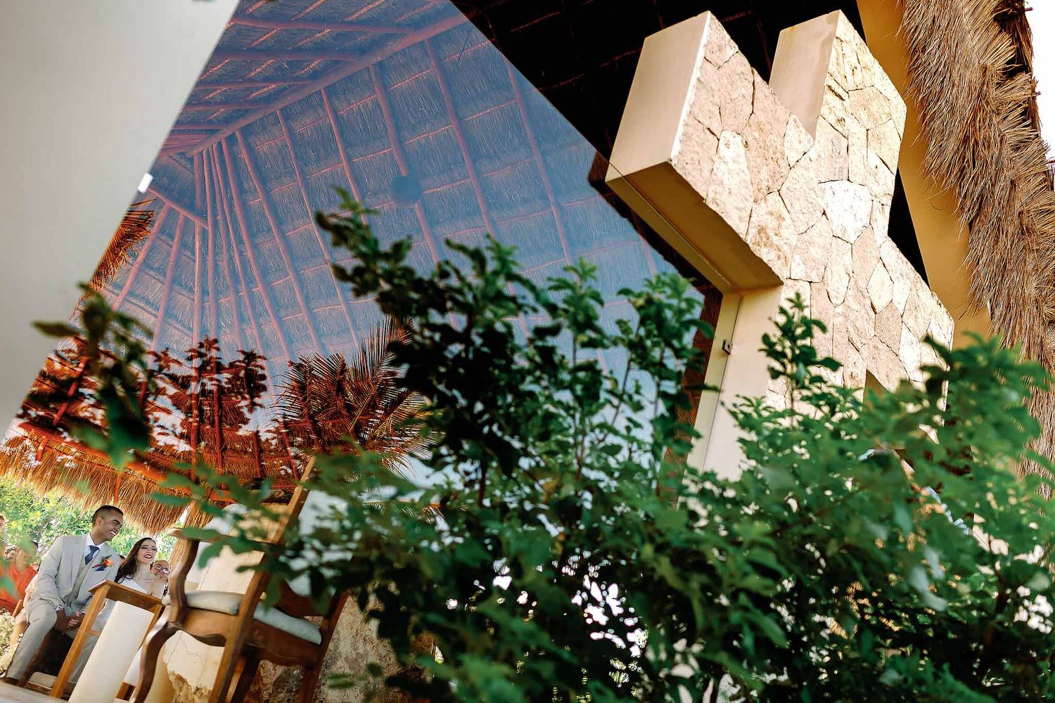 Modern Catholic chapel cross and tropical architecture at Jardín del Mar Cancun beach wedding venue