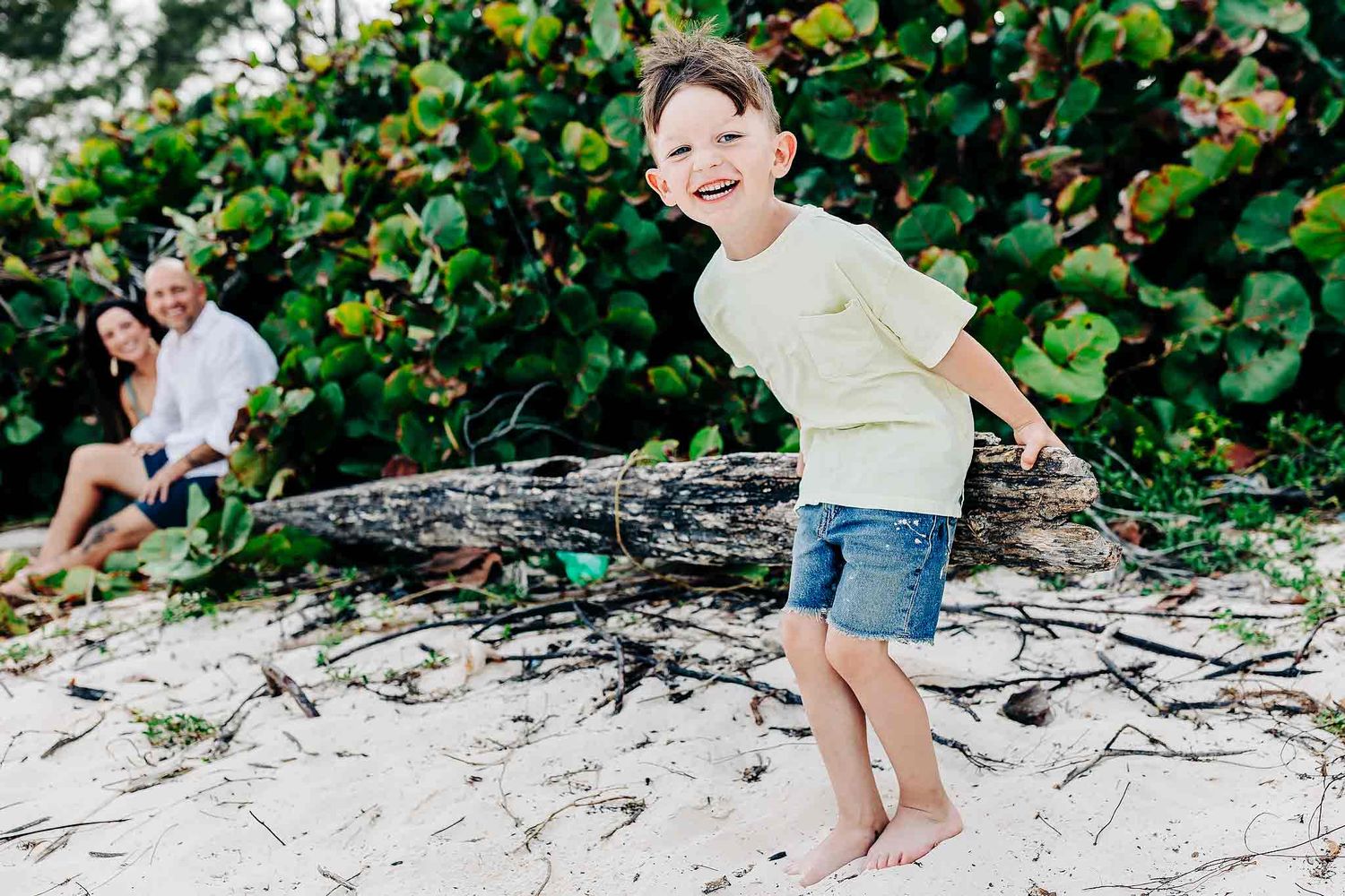 Smiling child portrait during a candid family beach session in Riviera Maya