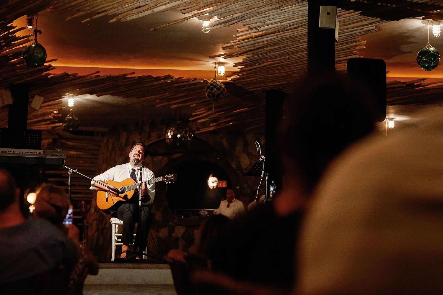 Duncan Sheik sings and plays guitar for Juliana and Tom at their wedding reception.