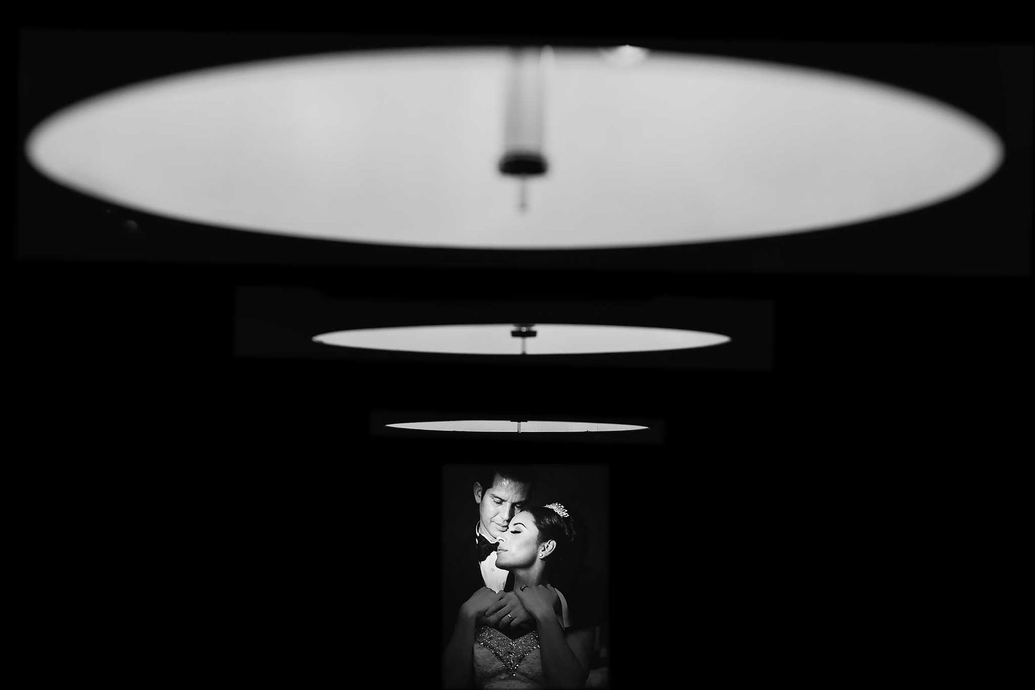 Black and white creative wedding portrait at JW Marriott Cancun with dramatic symmetry and artistic lighting composition.