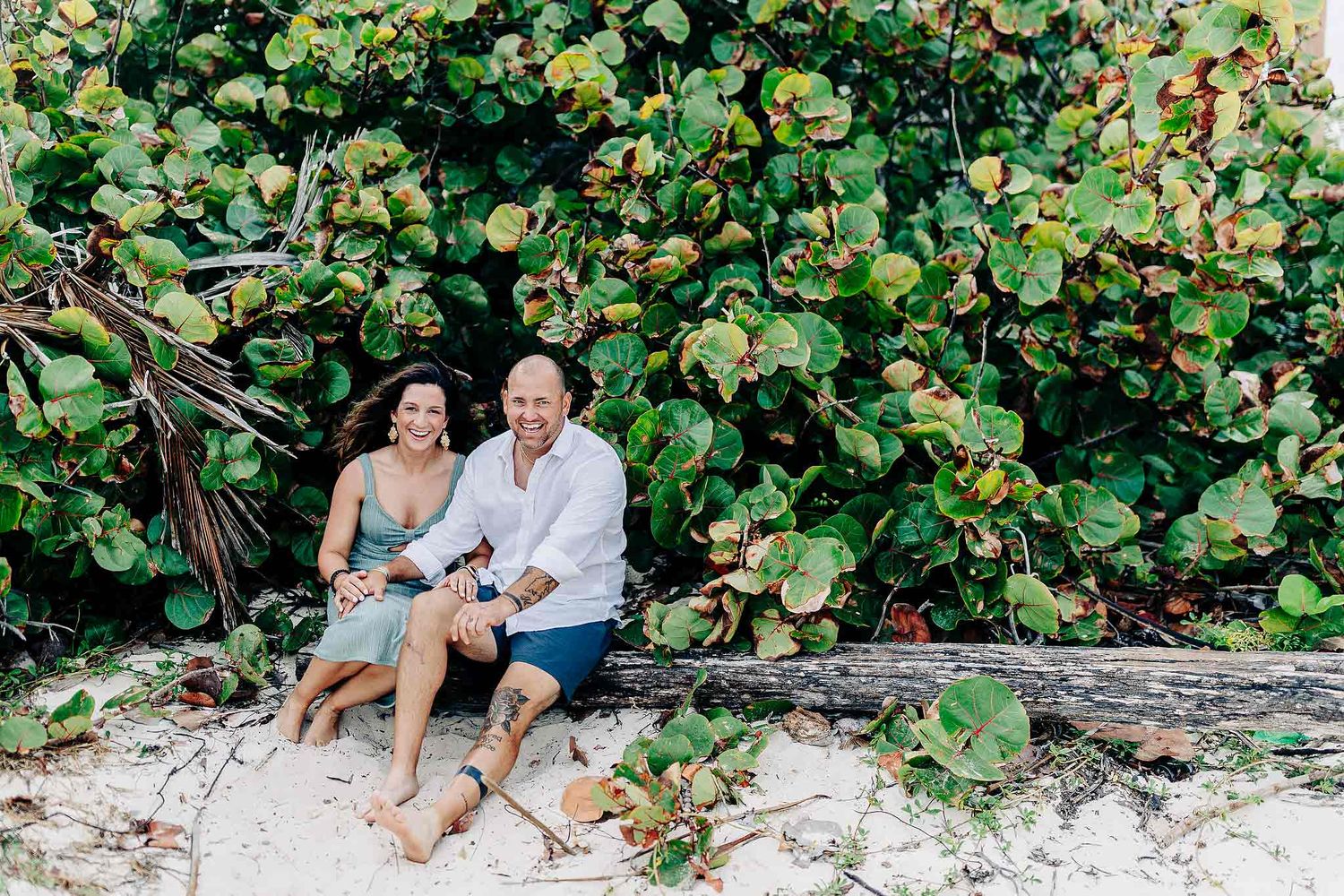 Relaxed family portrait surrounded by tropical greenery in Playa del Carmen